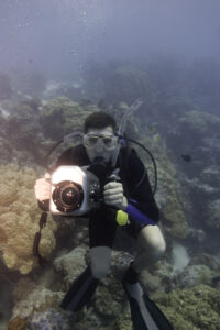 scuba diver taking underwater photographs 1931469